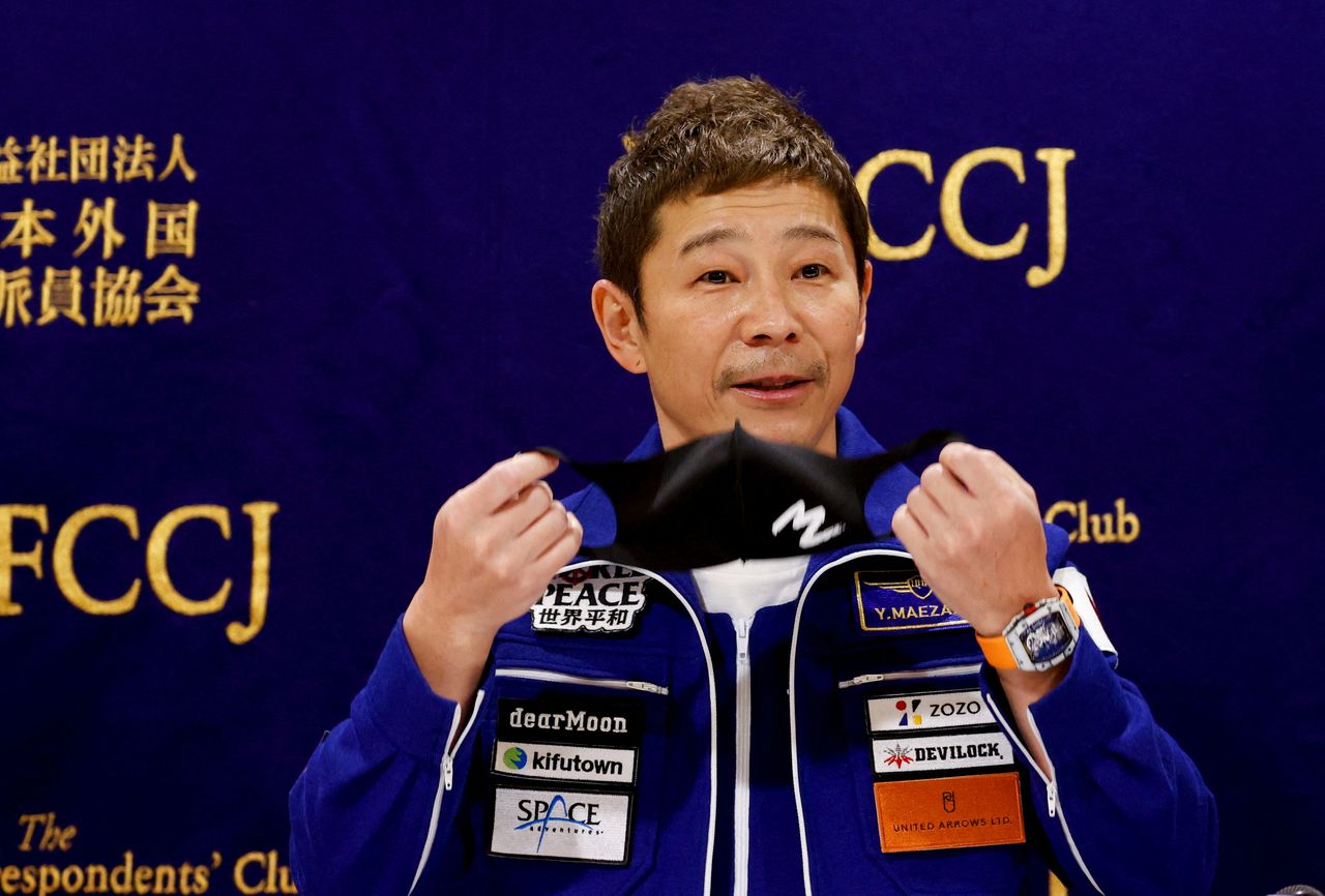 Japanese billionaire Yusaku Maezawa, who returned to Earth last month after a 12-day journey into space, attends a news conference after returning to Japan at the Foreign Correspondents