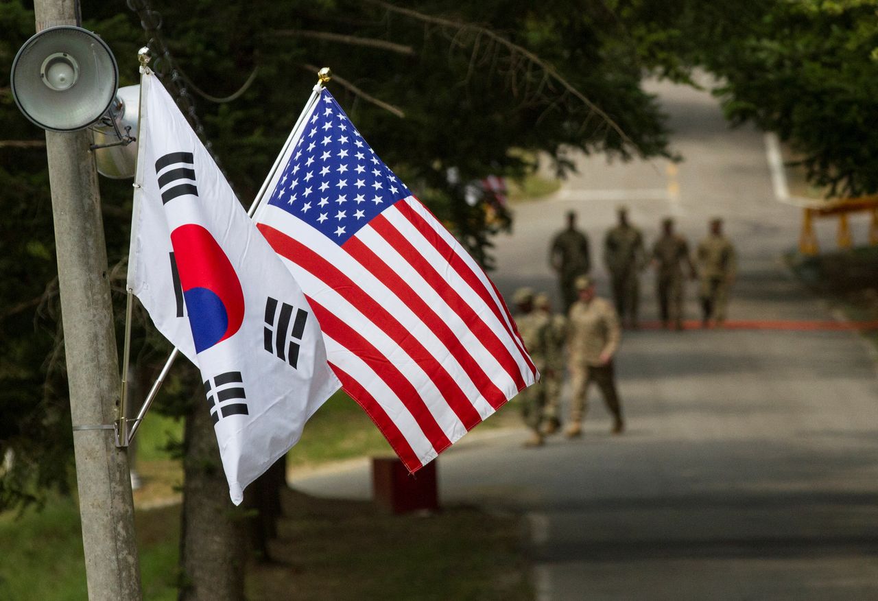 FILE PHOTO: The South Korean and American flags fly next to each other at Yongin, South Korea, August 23, 2016. Courtesy Ken Scar/U.S. Army/Handout via REUTERS   .