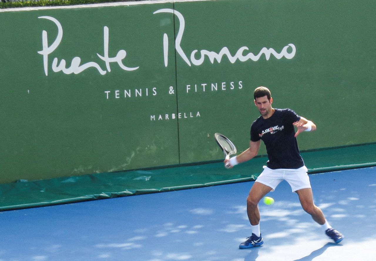 FILE PHOTO: Serbian tennis player Novak Djokovic trains at Puente Romano Tennis Club in Marbella, Spain, January 2, 2022. Picture taken January 2, 2022. KMJ-GTRES/Handout via REUTERS