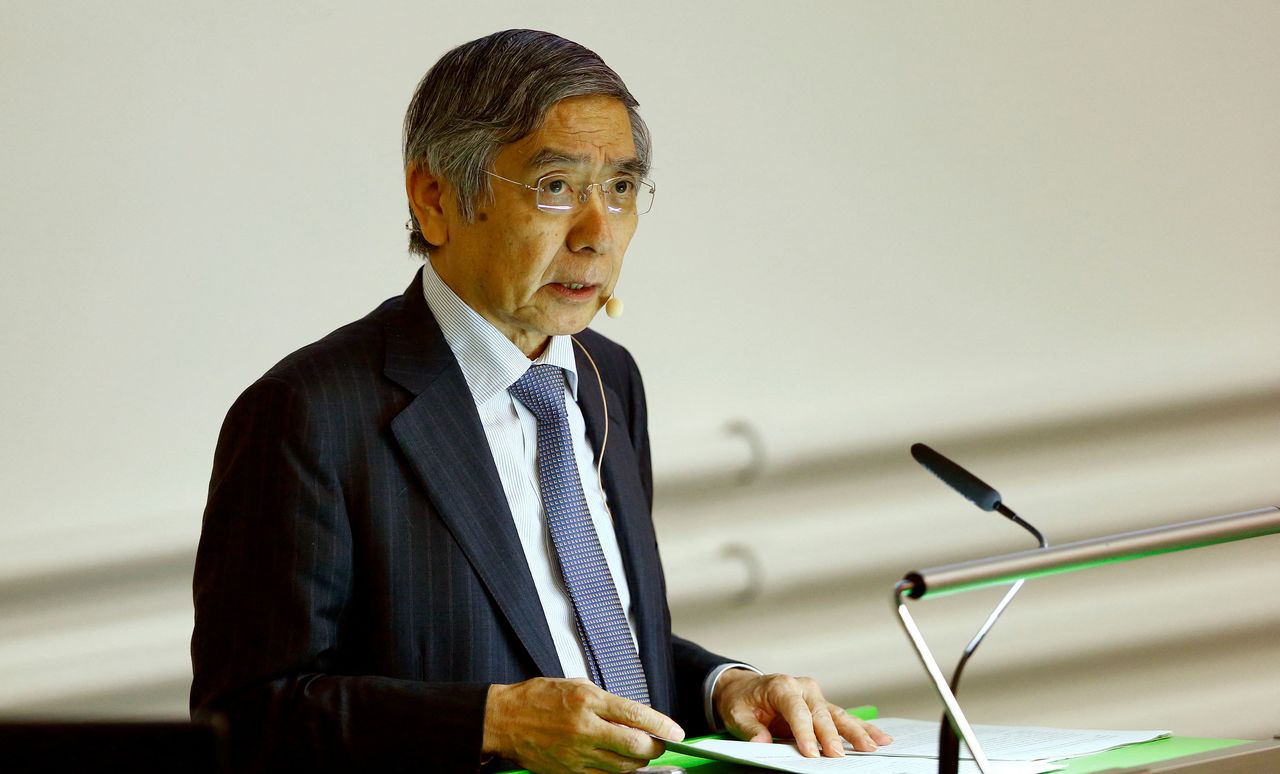 FILE PHOTO: Bank of Japan Governor Haruhiko Kuroda makes a speech at the University of Zurich in Zurich, Switzerland November 13, 2017.  REUTERS/Arnd Wiegmann