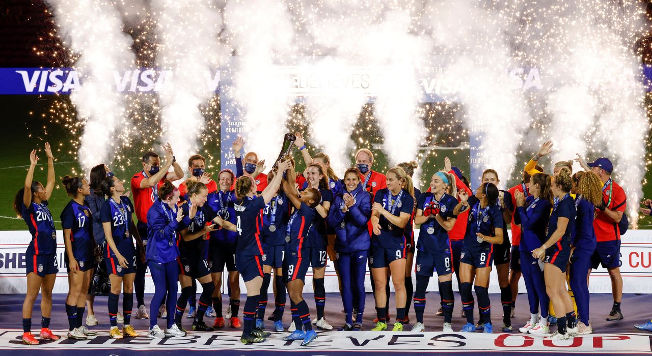 FILE PHOTO: Feb 24, 2021; Orlando, Florida, USA; Team United States celebrates their win with a trophy presentation   following the She Believes Cup soccer match win over Argentina at Exploria Stadium. Mandatory Credit: Reinhold Matay-USA TODAY Sports