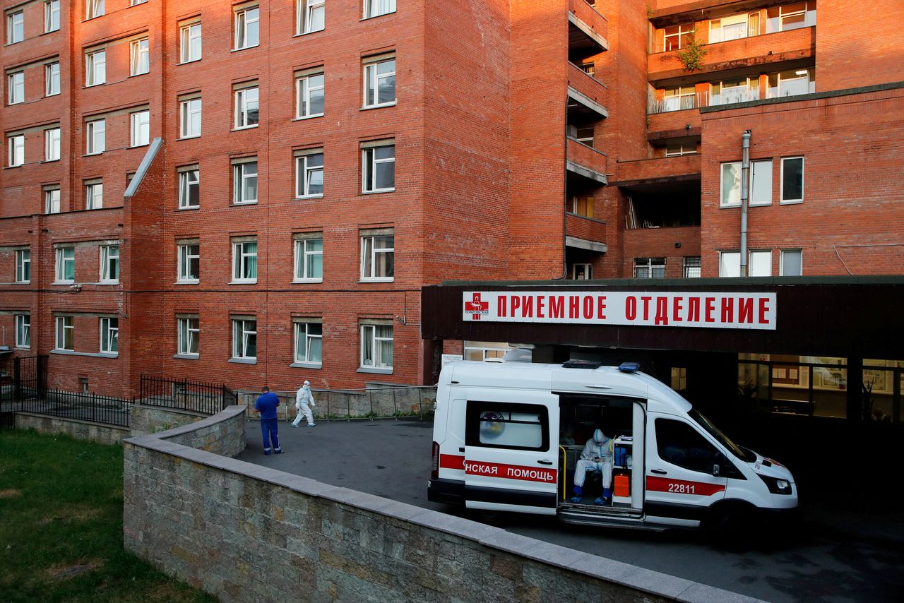 FILE PHOTO: A medical specialist wearing protective gear sits in an ambulance parked at the Pokrovskaya hospital amid the outbreak of the coronavirus disease (COVID-19) in Saint Petersburg, Russia June 24, 2021.  REUTERS/Anton Vaganov