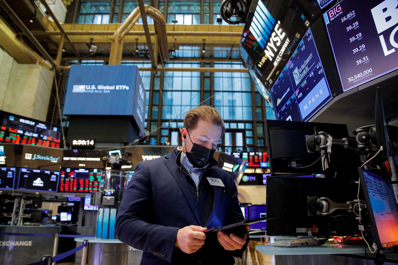 FILE PHOTO: A trader works on the floor of the New York Stock Exchange (NYSE) in New York City, U.S., January 21, 2022. REUTERS/Brendan McDermid