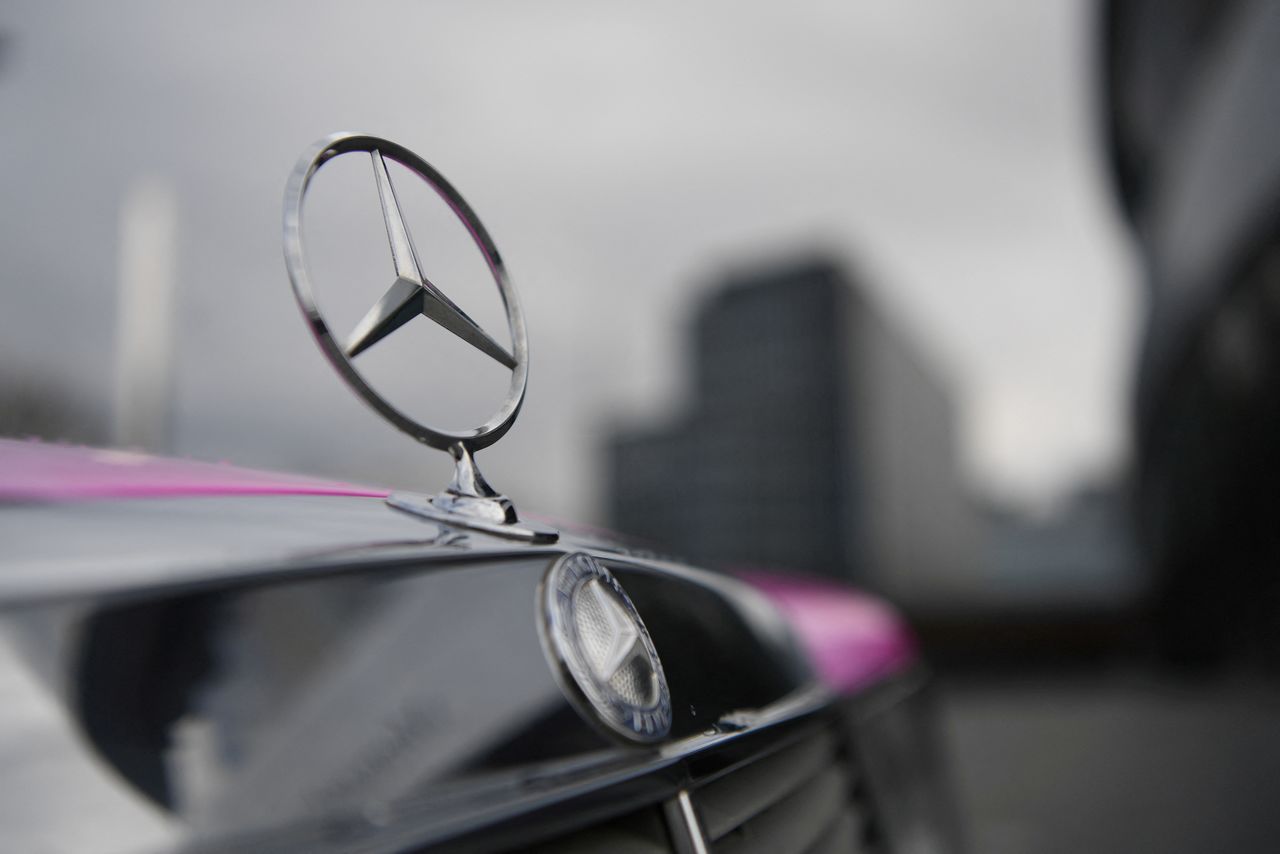FILE PHOTO: The Mercedes-Benz logo is seen on a car in front of the Mercedes-Benz Museum in Stuttgart, Germany February 11, 2020. REUTERS/Andreas Gebert