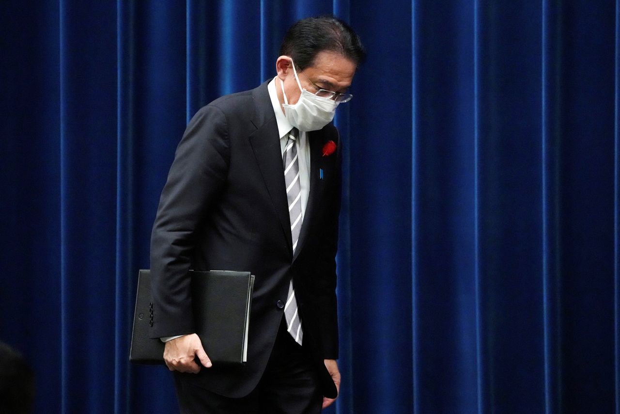 FILE PHOTO: Japanese Prime Minister Fumio Kishida leaves a news conference at the prime minister