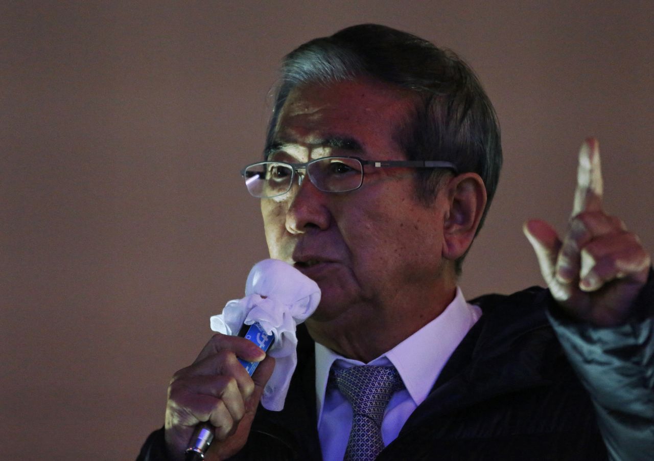 FILE PHOTO: Japan Restoration Party leader and nationalist, former Tokyo governor Shintaro Ishihara delivers a speech to voters atop a campaign van at Shinjuku district in Tokyo December 15, 2012. REUTERS/Issei Kato