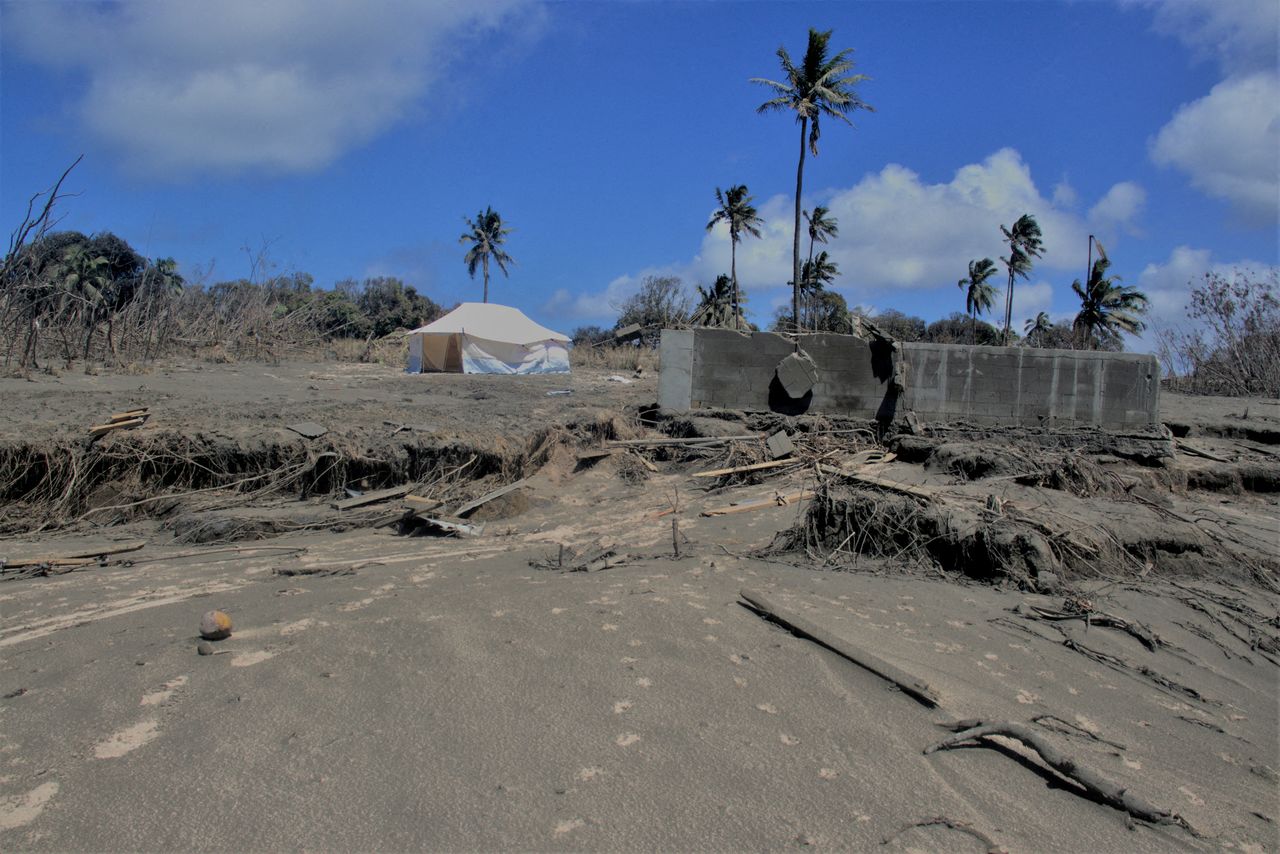FILE PHOTO: A general view shows damaged buildings and landscape covered with ash following the volcanic eruption and tsunami in Kanokupolu, Tonga, January 23,2022. Tonga Red Cross Society/Handout via REUTERS MANDATORY CREDIT/File Photo