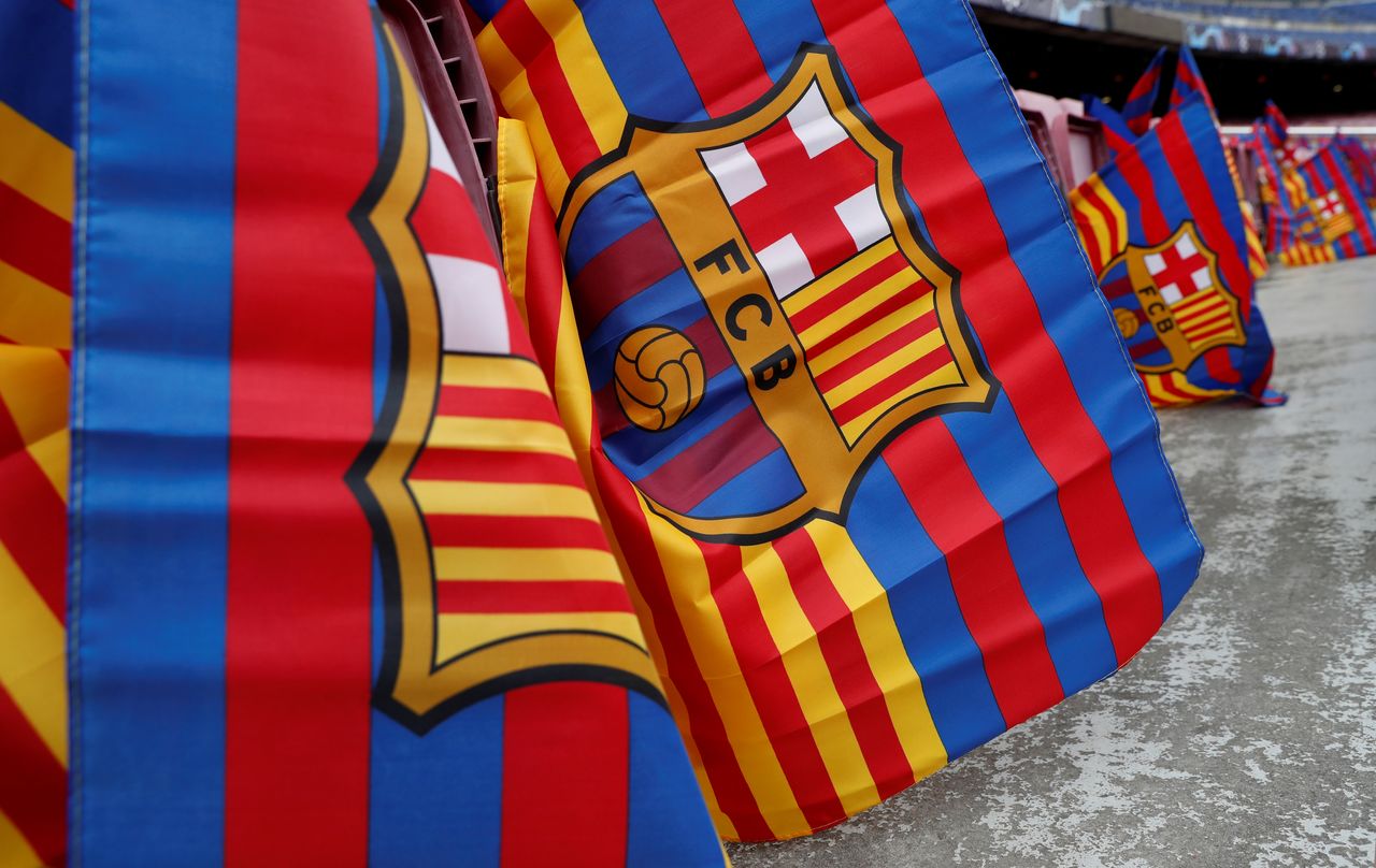 FILE PHOTO: Soccer Football - Champions League Quarter Final Second Leg - FC Barcelona v Manchester United - Camp Nou, Barcelona, Spain - April 16, 2019 General view of flags before the match REUTERS/Susana Vera