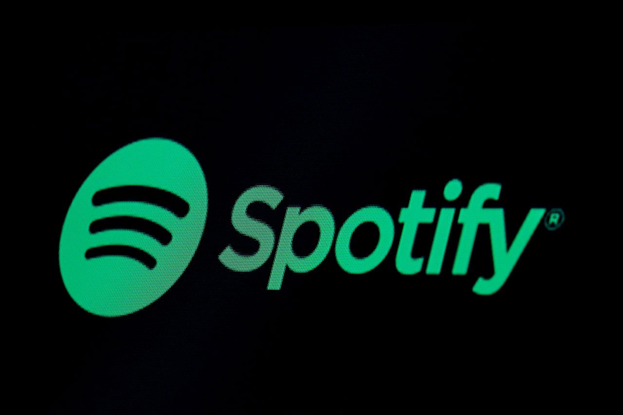 FILE PHOTO: The Spotify logo is displayed on a screen on the floor of the New York Stock Exchange (NYSE) in New York, U.S., May 3, 2018. REUTERS/Brendan McDermid
