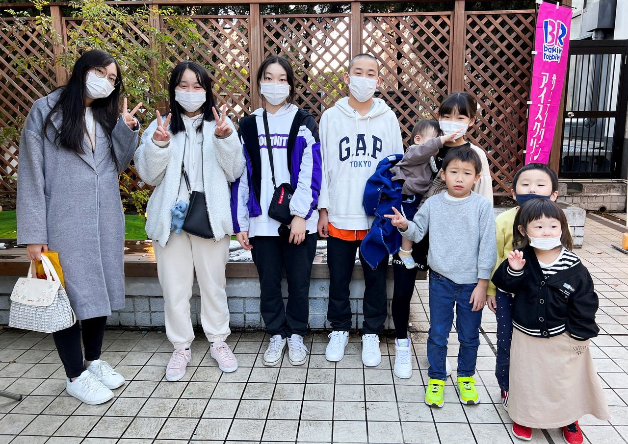 Children of Keiki Nambu and his wife Takako pose for a photograph during their family shopping, amid the coronavirus disease (COVID-19) pandemic, in Tokyo, Japan January 7, 2022. Picture taken January 7, 2022. REUTERS/Akiko Okamoto