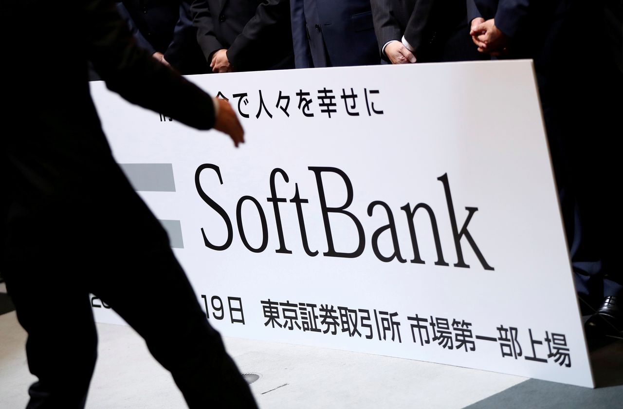 FILE PHOTO: SoftBank Corp. placard is prepared during a ceremony to mark the company