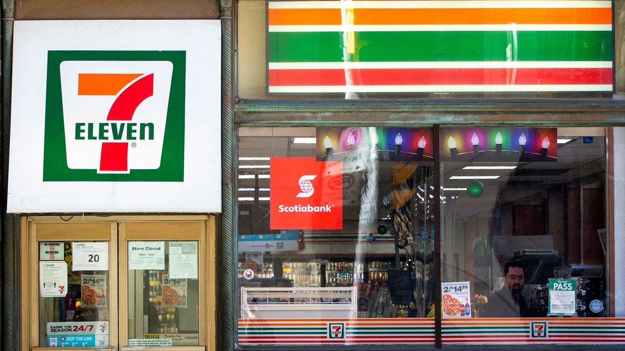 FILE PHOTO: A 7-Eleven storefront in Toronto, Ontario, Canada December 13, 2021. REUTERS/Carlos Osorio
