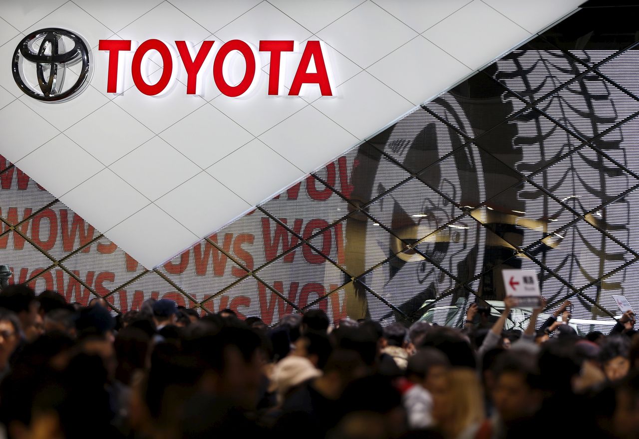 FILE PHOTO: Visitors crowd Toyota Motor Corp
