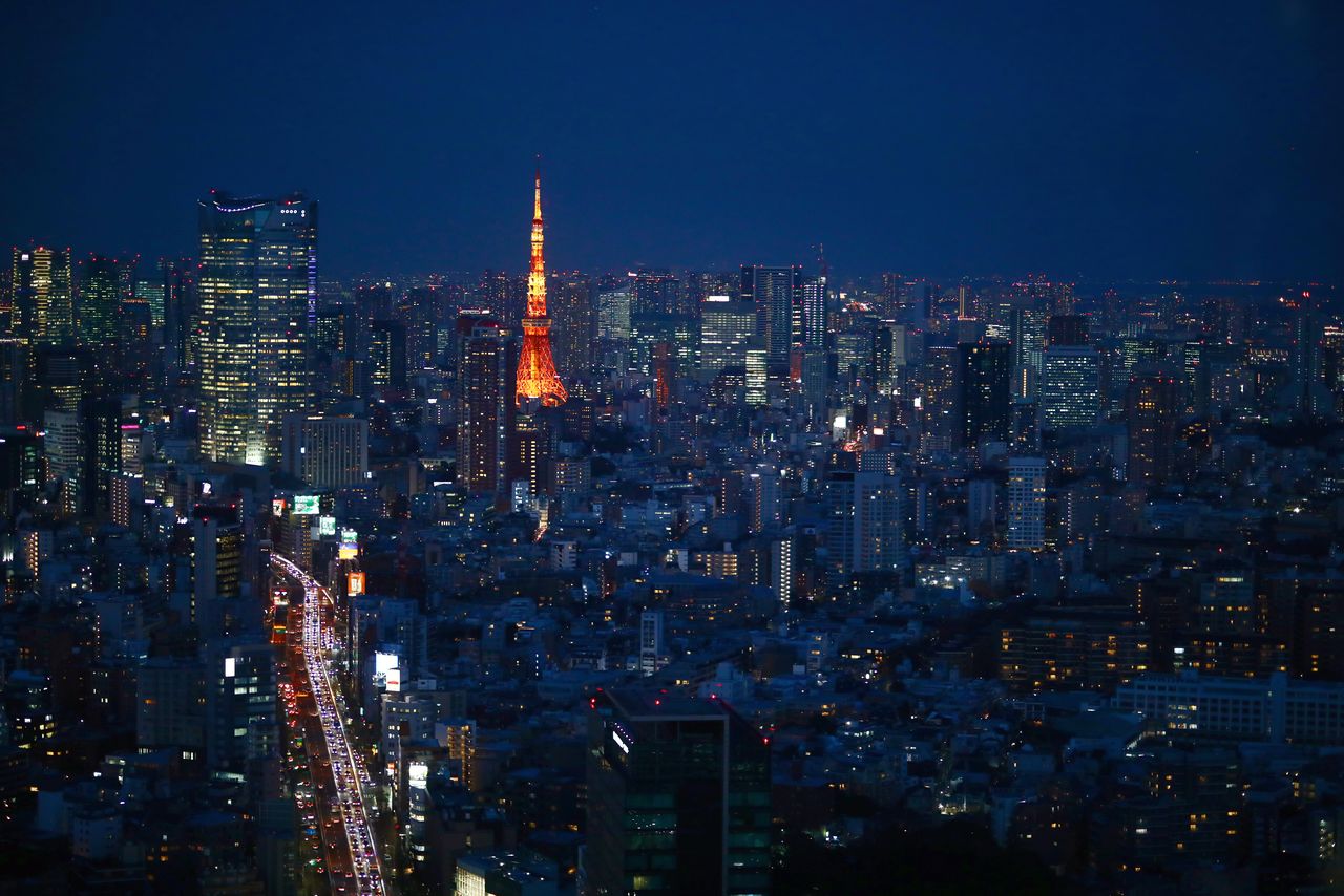 FILE PHOTO: A general view with Tokyo Tower is pictured in Tokyo, Japan March 12, 2020. REUTERS/Hannibal Hanschke
