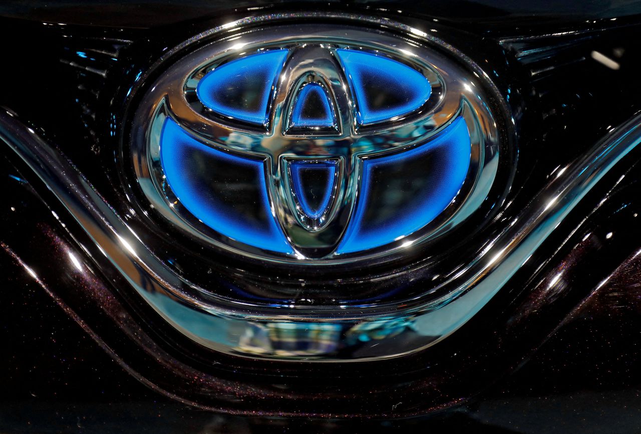FILE PHOTO: The Toyota logo is seen on the hood of a newly launched Camry Hybrid electric vehicle in New Delhi, India, January 18, 2019. REUTERS/Anushree Fadnavis