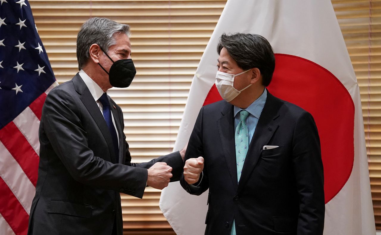 U.S. Secretary of State Antony Blinken and Japanese Foreign Minister Yoshimasa Hayashi fist bump as they meet before the Quad meeting of foreign ministers in Melbourne, Australia, February 11, 2022. REUTERS/Kevin Lamarque/POOL