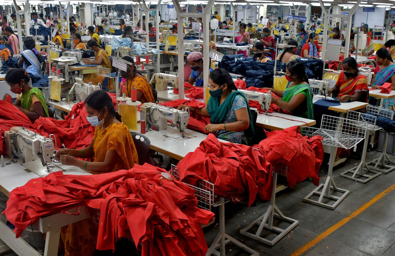 Garment workers stitch shirts at a textile factory of Texport Industries in Hindupur town in the southern state of Andhra Pradesh, India, February 9, 2022.   REUTERS/Samuel Rajkumar