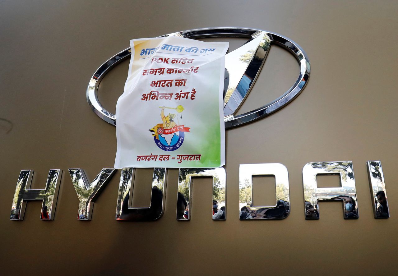 The logo of Hyundai is covered by a sticker pasted by the activists of Bajrang Dal, a Hindu hardline group, at a Hyundai showroom during a protest over their Pakistani partners