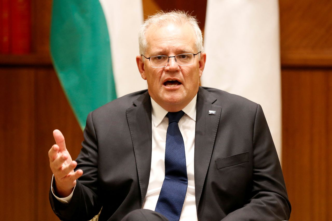 FILE PHOTO: Australian Prime Minister Scott Morrison speaks to the media at Melbourne Commonwealth Parliament Office, in Melbourne, Australia February 11, 2022. Darrian Traynor/Pool via REUTERS
