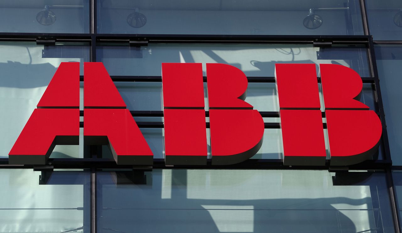 FILE PHOTO: The logo of Hitachi ABB is seen at an office building in Zurich, Switzerland September 10, 2020. REUTERS/Arnd Wiegmann
