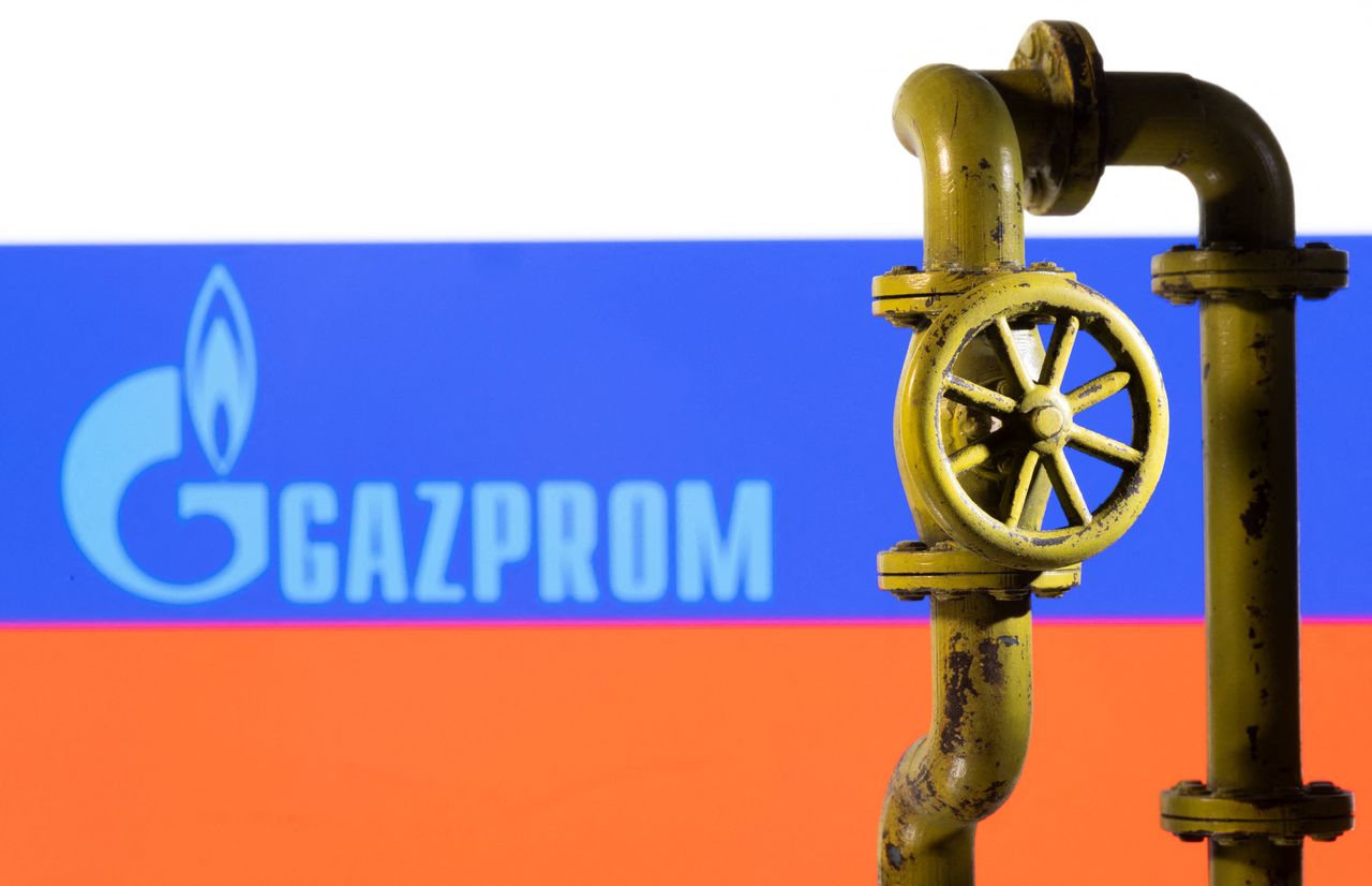FILE PHOTO: A 3D printed natural gas pipeline is placed in front of displayed Gazprom logo and Russian flag in this illustration taken February 8, 2022. REUTERS/Dado Ruvic