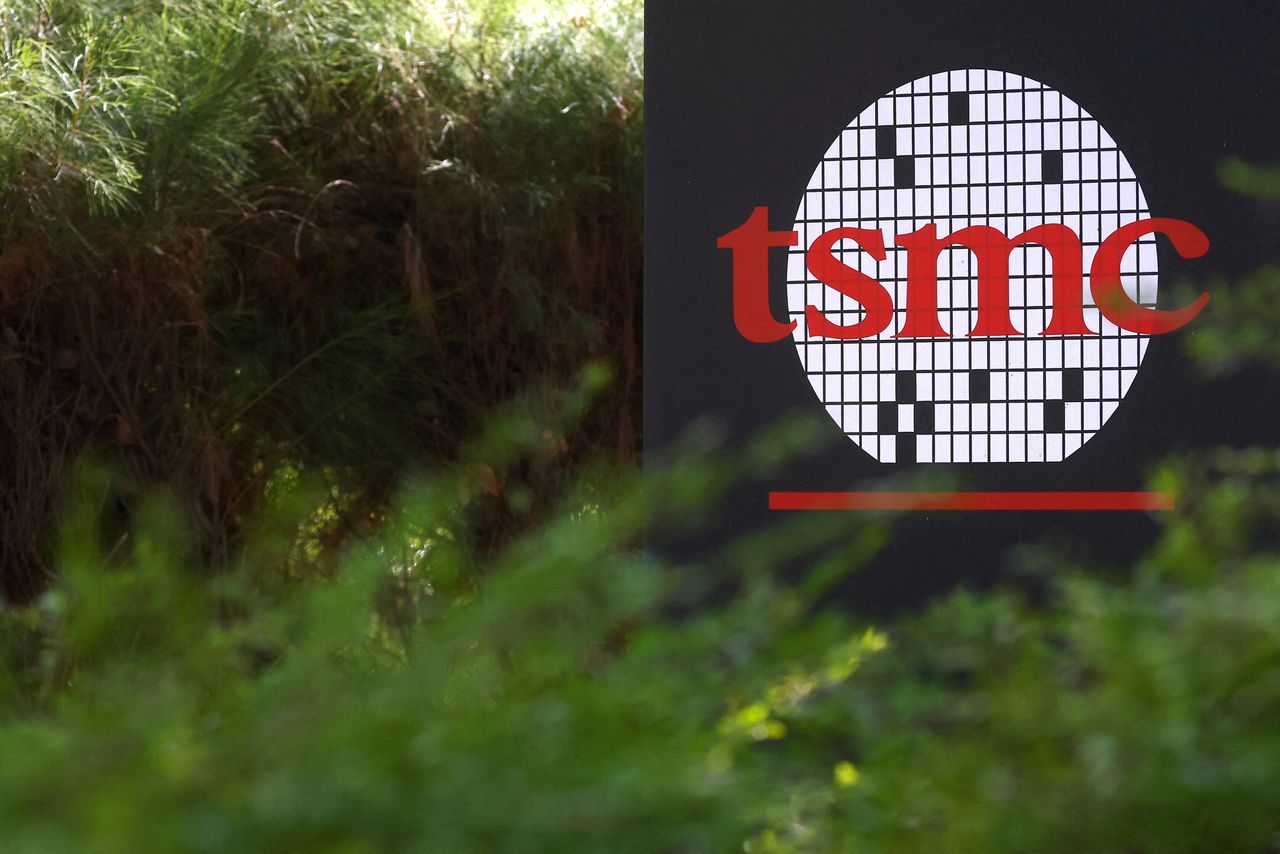 FILE PHOTO: The logo of Taiwan Semiconductor Manufacturing Co (TSMC) is pictured at its headquarters, in Hsinchu, Taiwan, January 19, 2021. REUTERS/Ann Wang