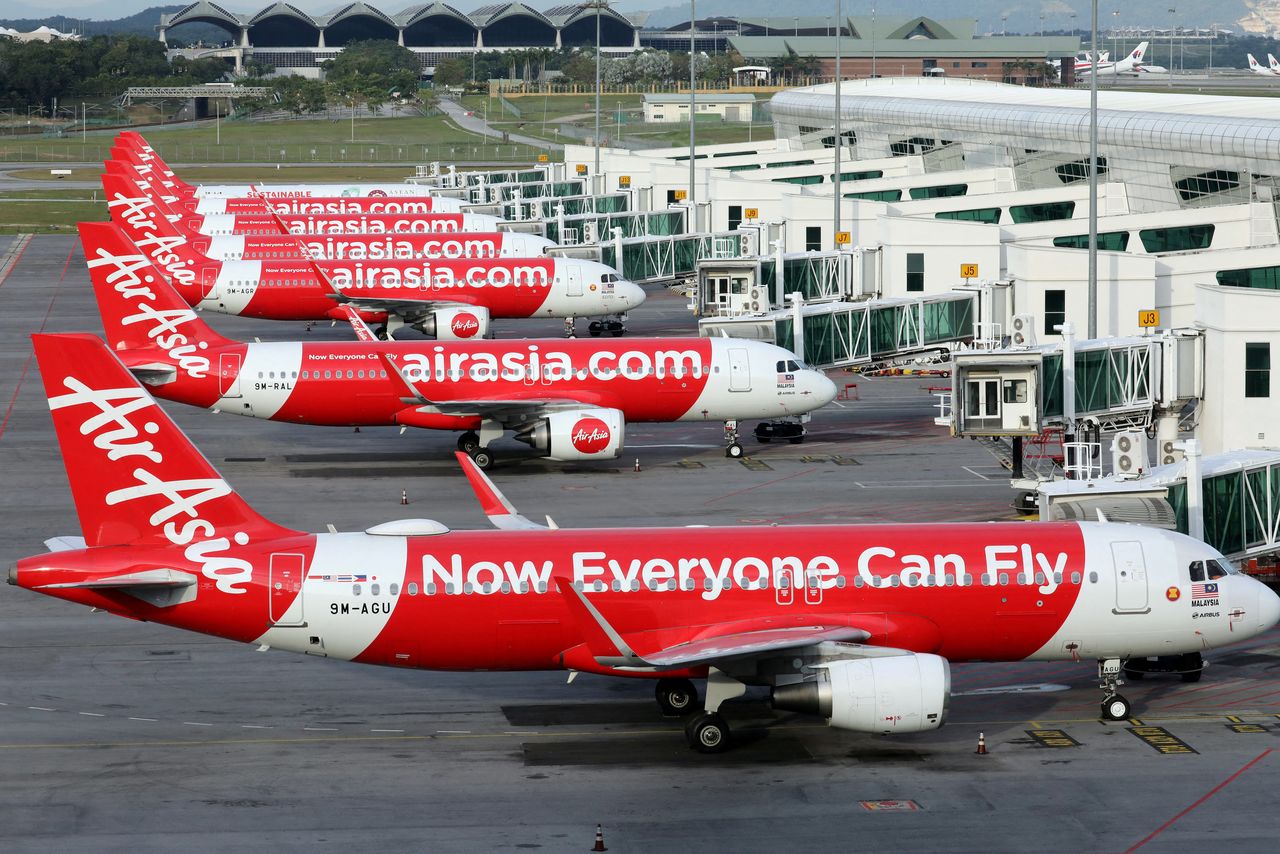 FILE PHOTO: Airasia planes are seen parked at Kuala Lumpur International Airport 2, amid the coronavirus disease (COVID-19) outbreak in Sepang, Malaysia October 6, 2020. REUTERS/Lim Huey Teng