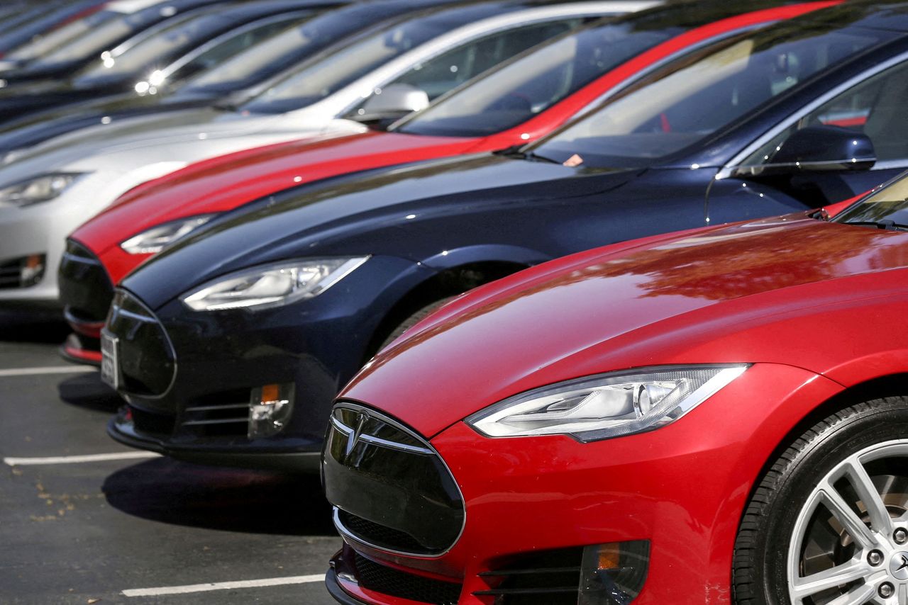 FILE PHOTO: A row of Tesla Model S sedans are seen outside the company