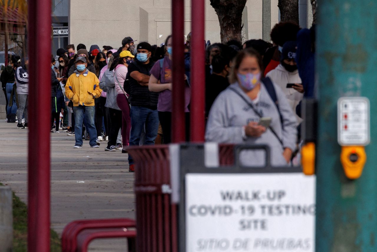 FILE PHOTO: People wait outside a community center as long lines continue for individuals trying to be tested for COVID-19 during the outbreak of the coronavirus disease in San Diego, California, U.S., January 10, 2022. REUTERS/Mike Blake/File Photo