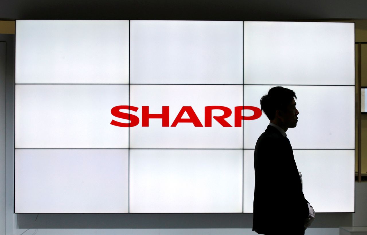 FILE PHOTO: A logo of Sharp Corp is pictured at CEATEC (Combined Exhibition of Advanced Technologies) JAPAN 2016 at the Makuhari Messe in Chiba, Japan, October 3, 2016.   REUTERS/Toru Hanai