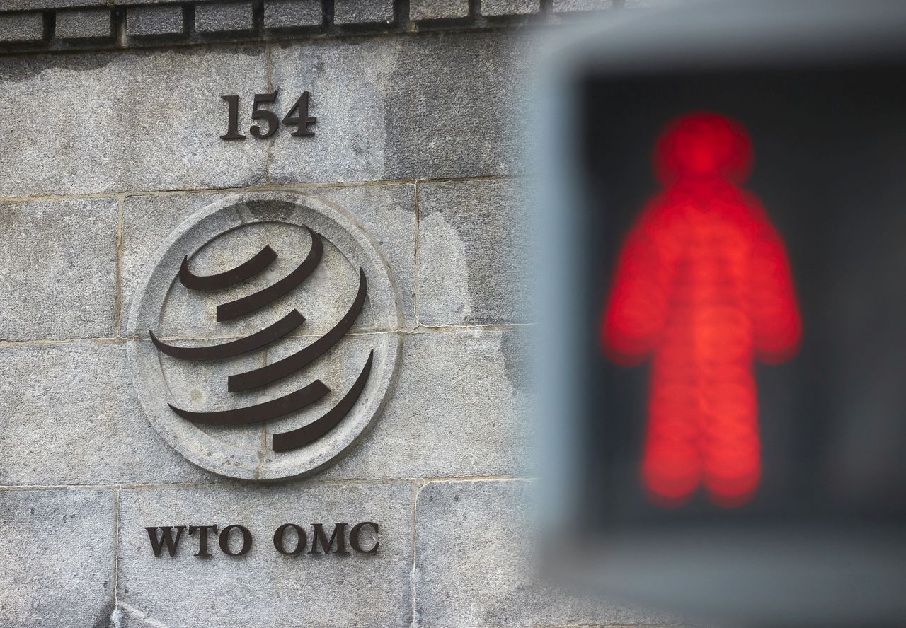 FILE PHOTO: A logo is pictured on the World Trade Organisation (WTO) building before a ministerial meeting to discuss a draft agreement on curbing subsidies for the fisheries industry in Geneva, Switzerland, July 15, 2021. REUTERS/Denis Balibouse