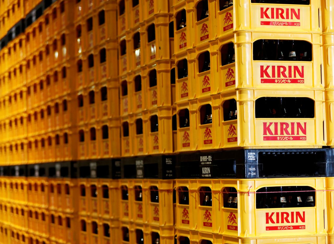FILE PHOTO: Plastic crates containing Kirin brand beer bottles are seen at Kirin Brewery Co. Yokohama Factory in Yokohama, south of Tokyo, Japan June 11, 2019.  REUTERS/Issei Kato