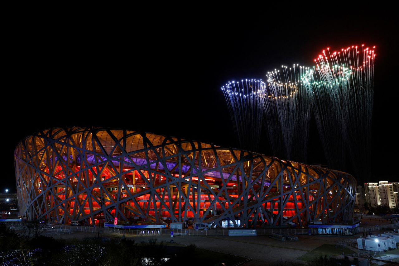 Fireworks explode over the National Stadium, also known as the Bird