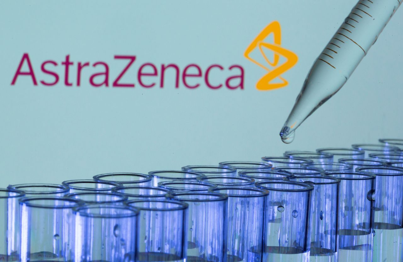 FILE PHOTO: Test tubes are seen in front of a displayed AstraZeneca logo in this illustration taken, May 21, 2021. REUTERS/Dado Ruvic