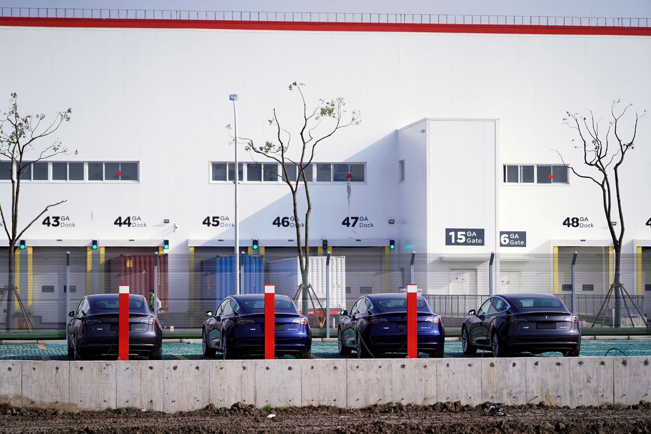 FILE PHOTO: China-made Tesla Model 3 electric vehicles are seen at the Gigafactory of electric carmaker Tesla Inc in Shanghai,  China December 2, 2019. REUTERS/Aly Song/File Photo