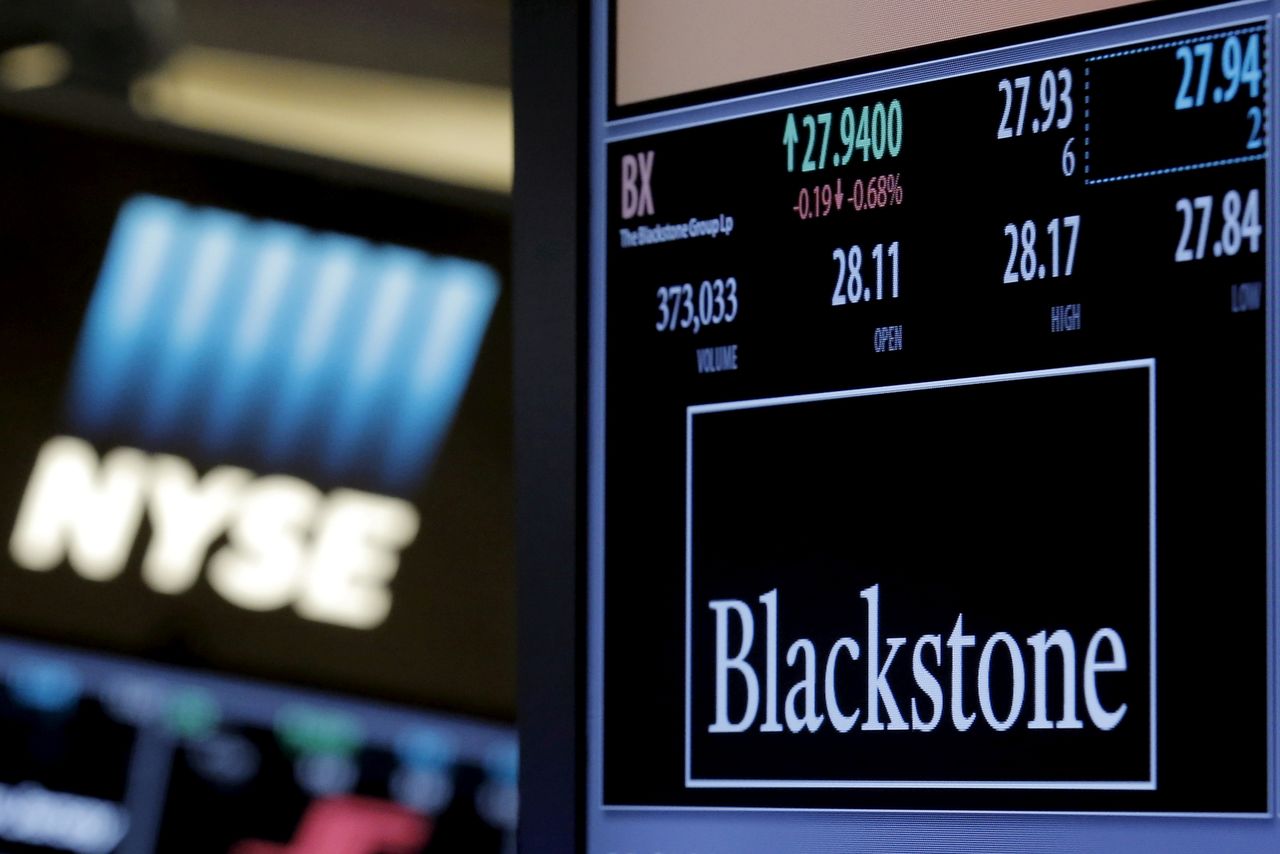 FILE PHOTO: The ticker and trading information for Blackstone Group is displayed at the post where it is traded on the floor of the New York Stock Exchange (NYSE) April 4, 2016. REUTERS/Brendan McDermid