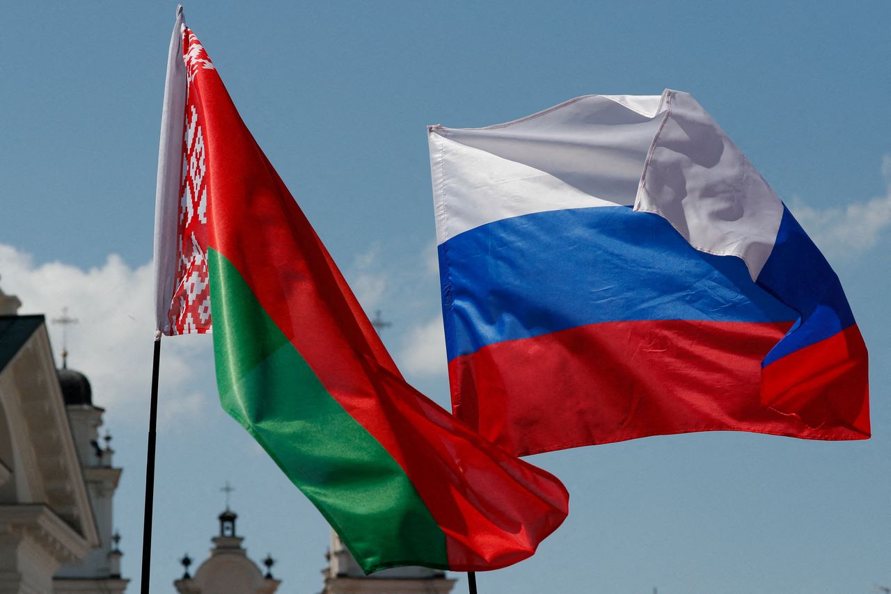 FILE PHOTO: Belarusian and Russian national flags fly during "Day of multinational Russia" event in central Minsk, Belarus June 8, 2019.  REUTERS/Vasily Fedosenko/File Photo
