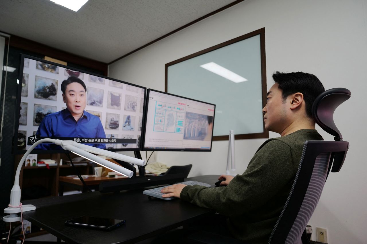 Lee Jae-hong, 39, who owns the YouTube channel "The Blade of Knowledge", works at his office in Ilsan, South Korea, February 17, 2022. Picture taken February 17, 2022.   REUTERS/Daewoung Kim