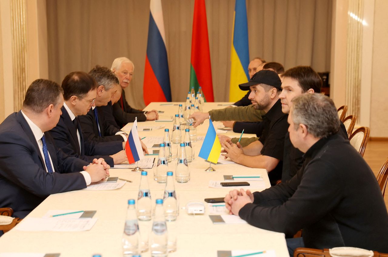 Russian and Ukrainian officials take part in the talks in the Gomel region, Belarus February 28, 2022.  Sergei Kholodilin/BelTA/Handout via REUTERS