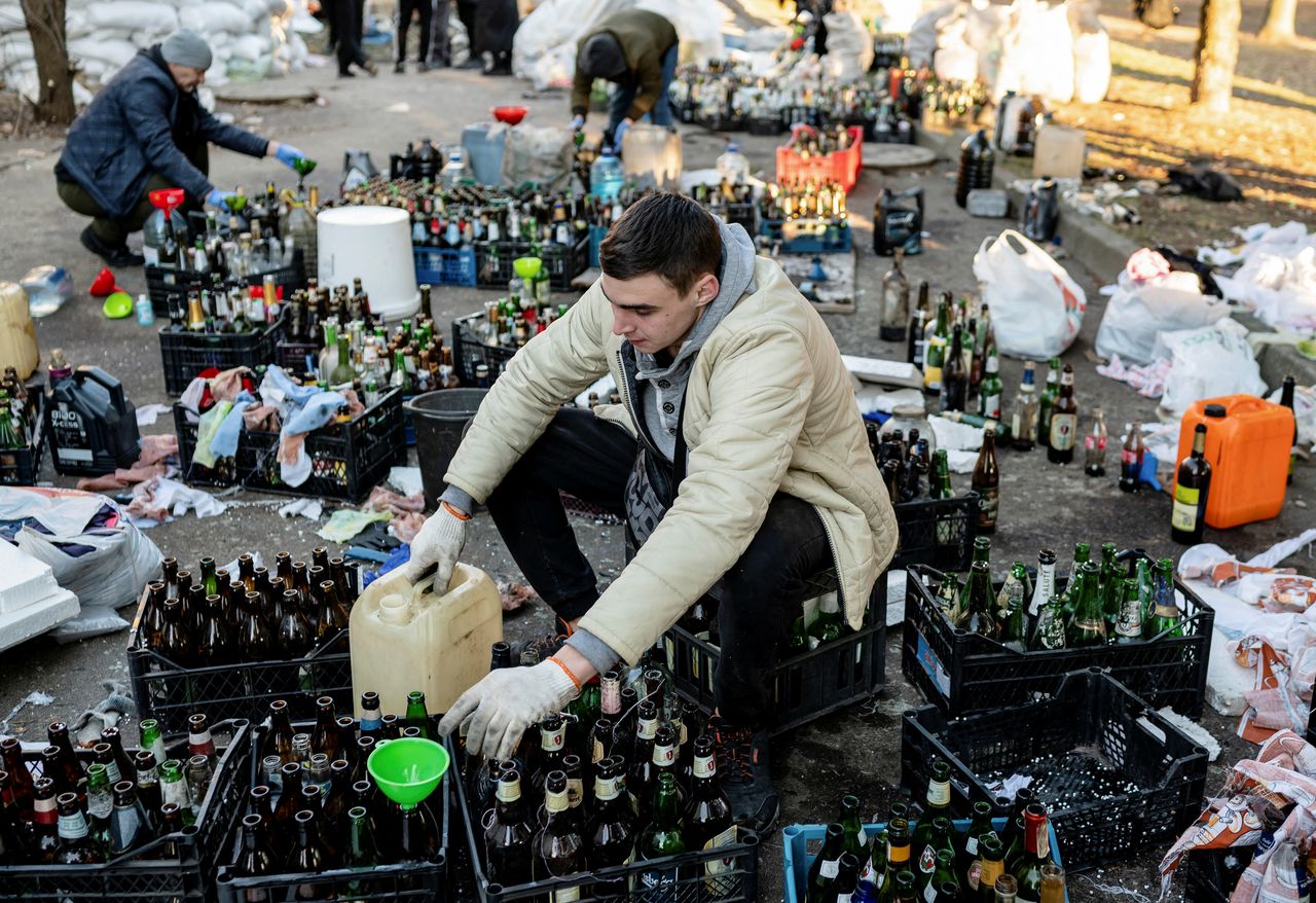Local residents prepare Molotov cocktails, as Russia