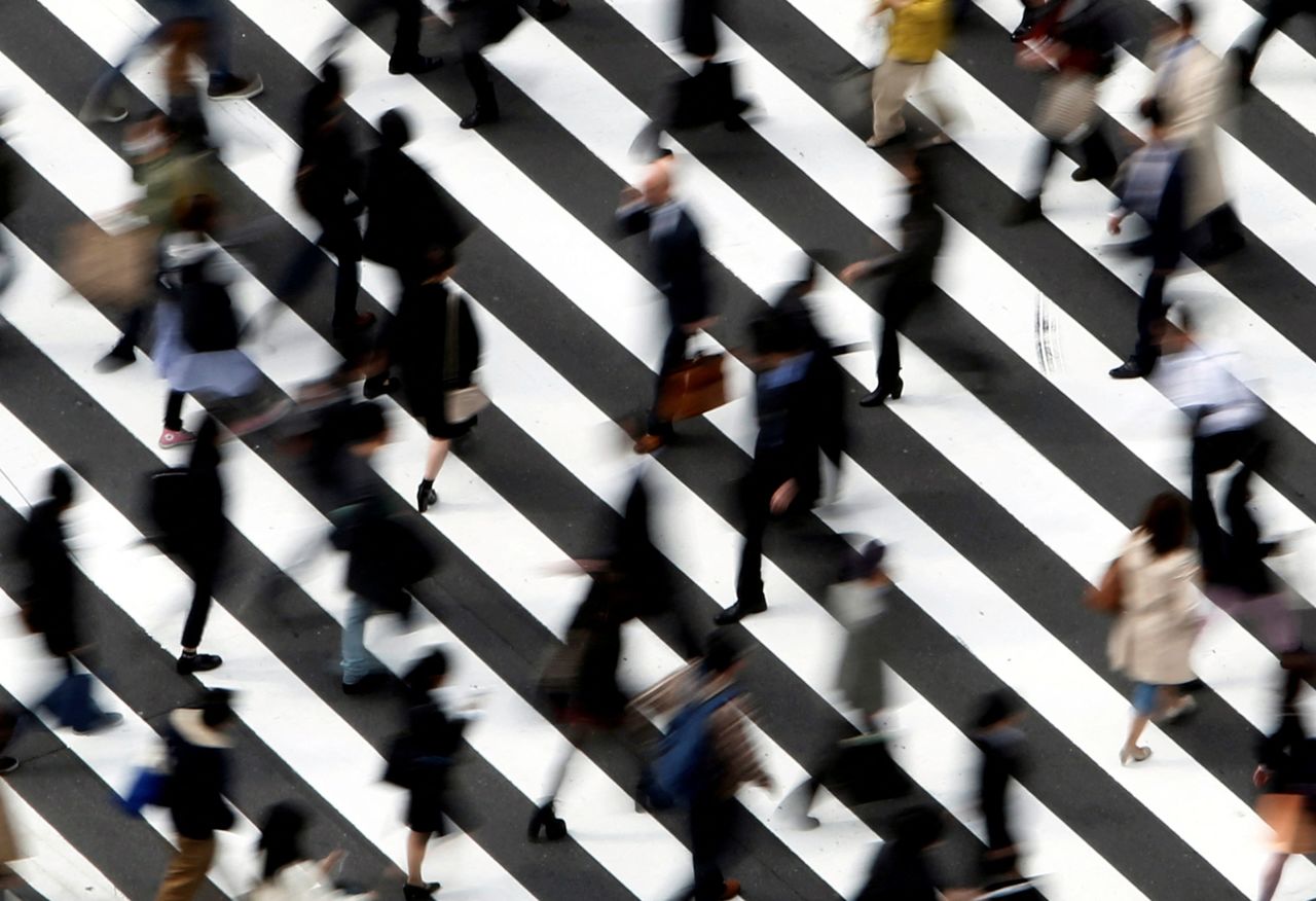 FILE PHOTO: People cross a street in Tokyo March 18, 2015. REUTERS/Yuya Shino