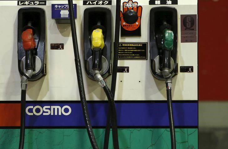 FILE PHOTO: Petrol nozzles are seen at Cosmo Energy Holdings
