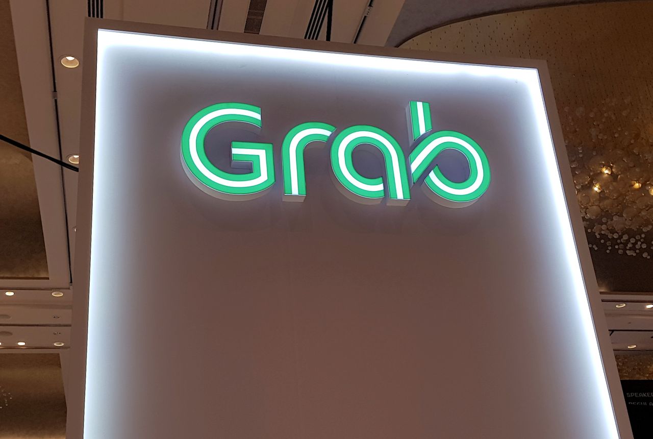 FILE PHOTO: A Grab logo is pictured at the Money 20/20 Asia Fintech Trade Show in Singapore March 21, 2019. REUTERS/Anshuman Daga