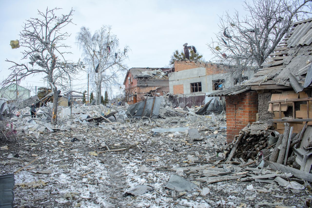 Debris is seen next to houses destroyed by shelling, amid Russia