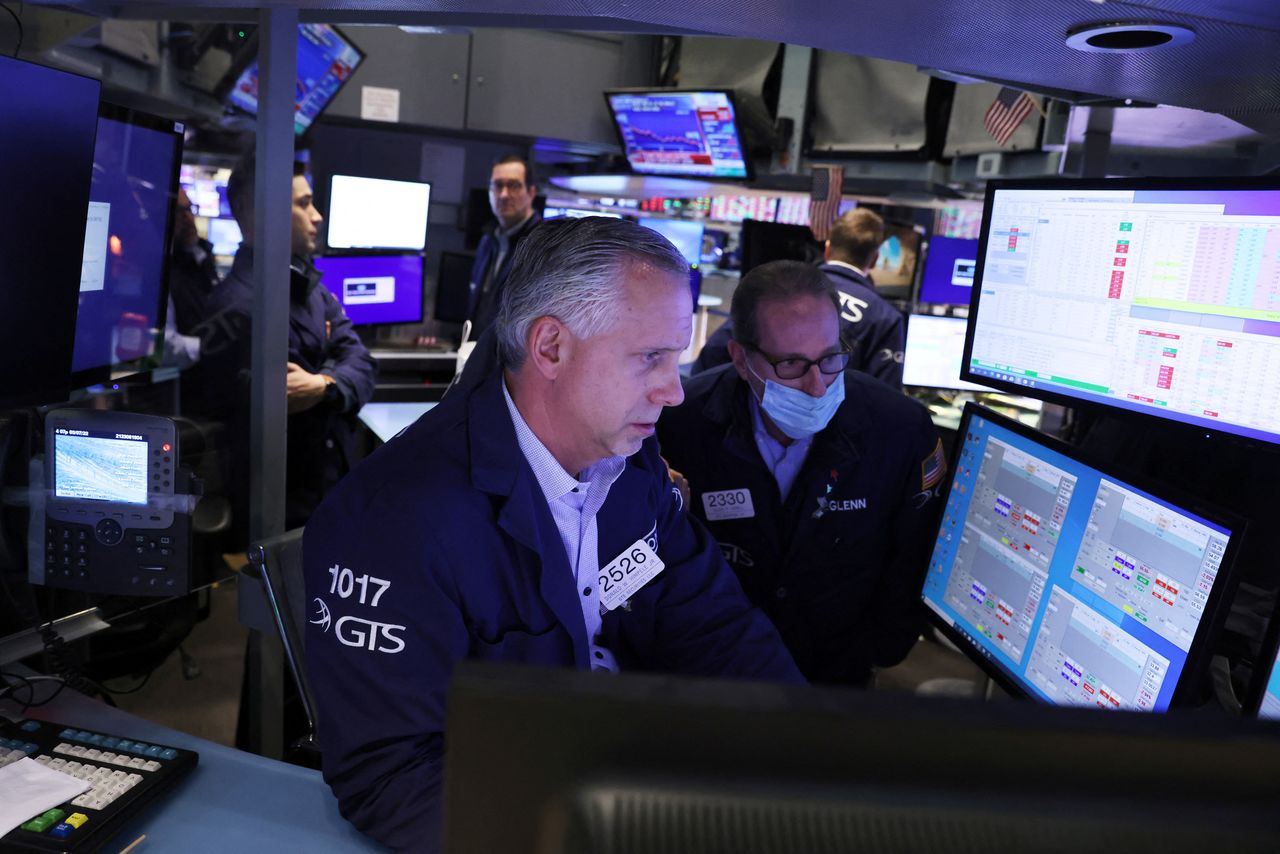 Traders work on the trading floor at the New York Stock Exchange (NYSE) in Manhattan, New York City, U.S., March 7, 2022. REUTERS/Andrew Kelly