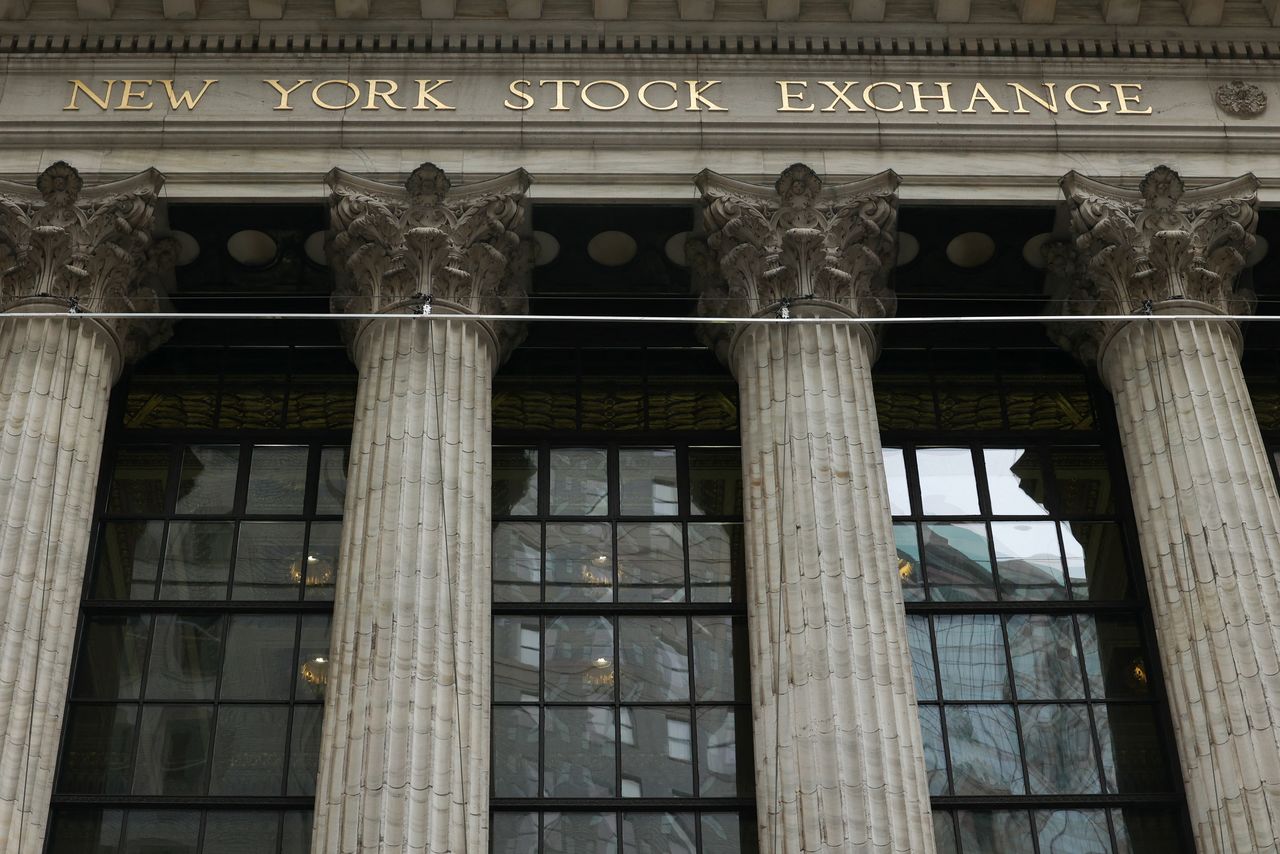 FILE PHOTO: The New York Stock Exchange (NYSE) in New York City, where markets roiled after Russia continues to attack Ukraine, in New York, U.S., February 24, 2022.   REUTERS/Caitlin Ochs