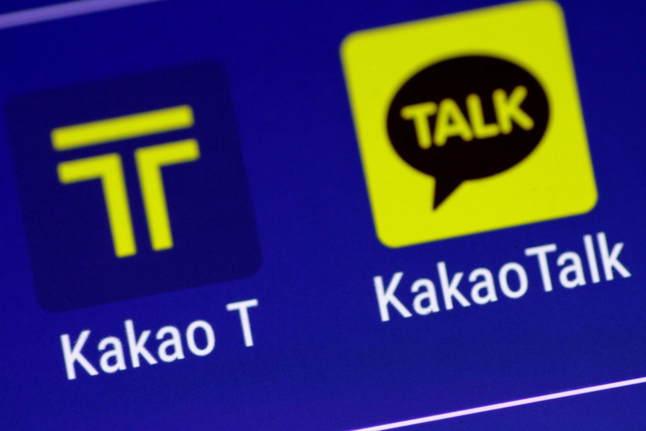 The Kakao messaging application and the Kakao T taxi booking application are seen on a mobile phone in this illustration photo March 13, 2018. REUTERS/Thomas White/Illustration/Files