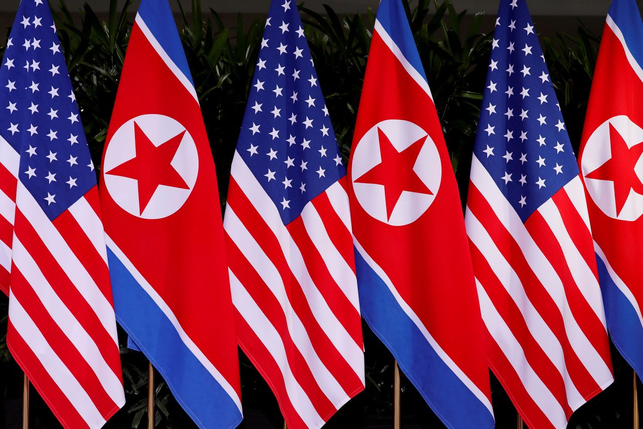 FILE PHOTO: U.S. and North Korean national flags are seen at the Capella Hotel on Sentosa island in Singapore June 12, 2018. REUTERS/Jonathan Ernst/File Photo