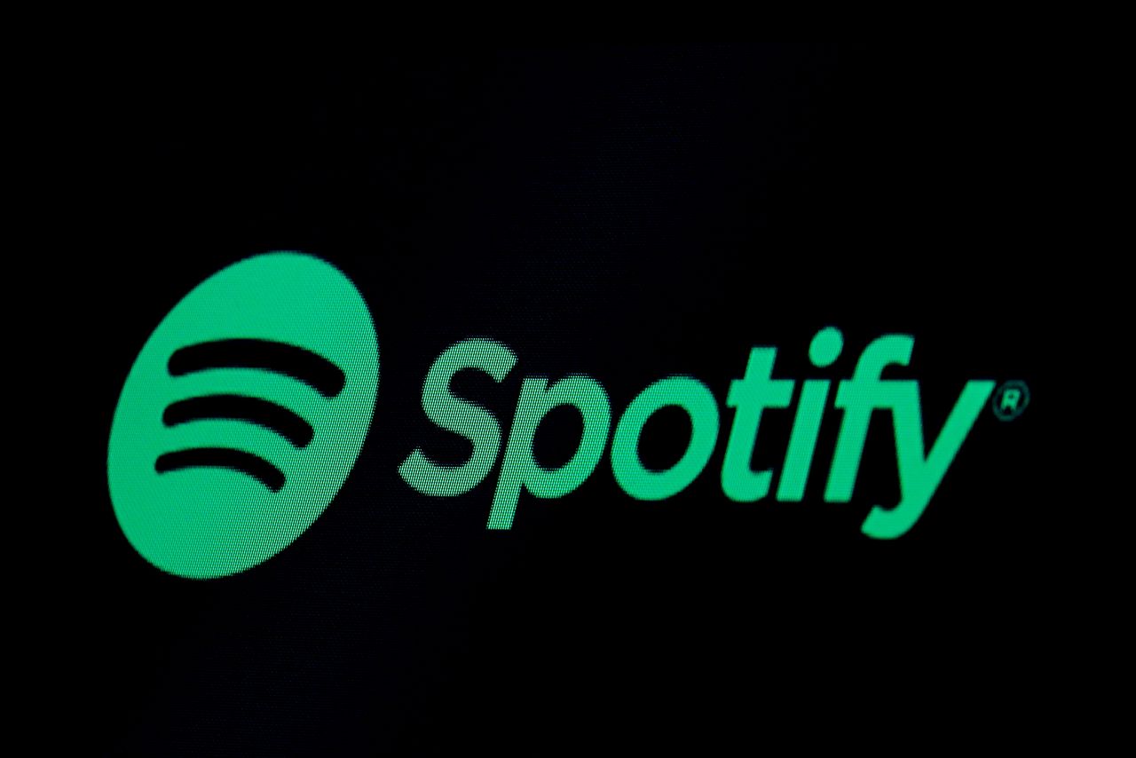 FILE PHOTO: The Spotify logo is displayed on a screen on the floor of the New York Stock Exchange (NYSE) in New York, U.S., May 3, 2018. REUTERS/Brendan McDermid/File Photo