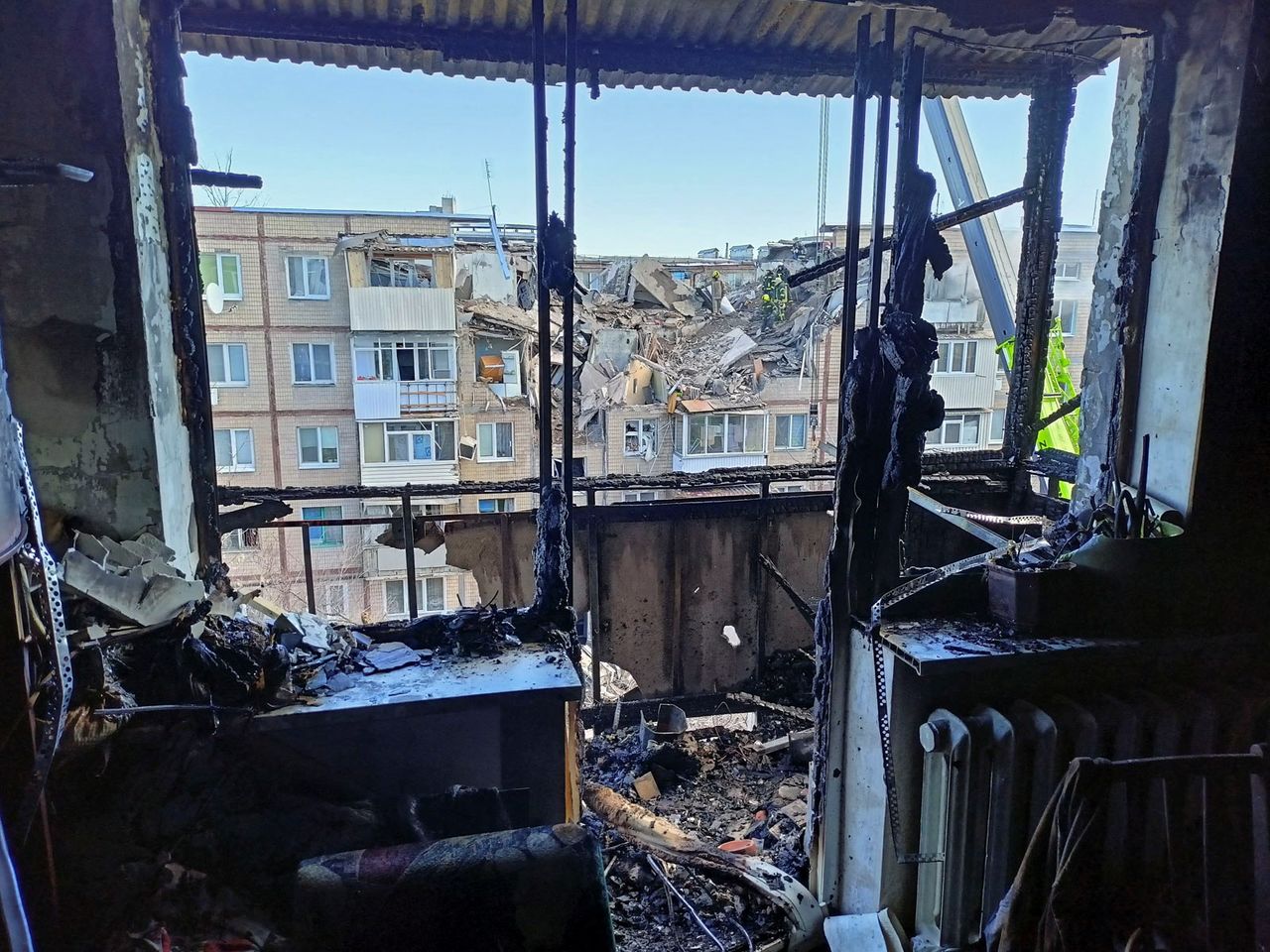 An interior view shows an apartment inside a residential building damaged by an airstrike, as Russia